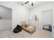 Well-lit bedroom featuring carpet floors and a toddler bed near the wall at 20648 Maxim Pkwy Pkwy, Orlando, FL 32833