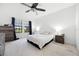 A neutral tone bedroom features carpet floors and a large window at 20648 Maxim Pkwy Pkwy, Orlando, FL 32833