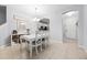 Dining area with white table and chairs, open to the kitchen at 20648 Maxim Pkwy Pkwy, Orlando, FL 32833