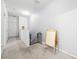 Upstairs hallway featuring carpet and a safety gate, with natural light and neutral tones at 20648 Maxim Pkwy Pkwy, Orlando, FL 32833