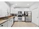 Well-lit kitchen featuring stainless steel appliances and granite countertops at 20648 Maxim Pkwy Pkwy, Orlando, FL 32833