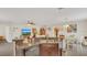 Kitchen featuring breakfast bar and stainless steel dishwasher at 2233 Tulip Valley Pt, Sanford, FL 32771