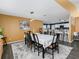 Dining area featuring a dining table with seating, an open layout, and views into the kitchen at 2454 Whitehorse St, Deltona, FL 32738