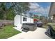 This image showcases a relaxing backyard hot tub and storage shed, perfect for outdoor relaxation and storage solutions at 2454 Whitehorse St, Deltona, FL 32738