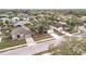 Overhead view shows houses neatly arranged in a neighborhood with tree canopies at 250 Ryans Ridge Ave, Eustis, FL 32726