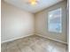 Bedroom showcasing tile flooring, ceiling fan, and window for natural light at 250 Ryans Ridge Ave, Eustis, FL 32726