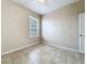 Cozy bedroom with bright window, ceiling fan, and tile flooring at 250 Ryans Ridge Ave, Eustis, FL 32726