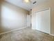 Bedroom with large closet, ceiling fan, and ceramic tile flooring at 250 Ryans Ridge Ave, Eustis, FL 32726