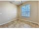 This bedroom has tiled floors, neutral paint, a ceiling fan, and a bright window at 250 Ryans Ridge Ave, Eustis, FL 32726