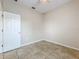 Bedroom showcasing tile flooring, ceiling fan, and window for natural light at 250 Ryans Ridge Ave, Eustis, FL 32726