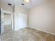 Neutral bedroom with closet, tile floor, and ceiling fan at 250 Ryans Ridge Ave, Eustis, FL 32726