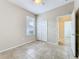 Bedroom featuring tile flooring, ceiling fan, and window for natural light at 250 Ryans Ridge Ave, Eustis, FL 32726