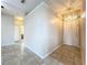 Inviting entryway featuring neutral paint, tile flooring and a decorative light fixture at 250 Ryans Ridge Ave, Eustis, FL 32726