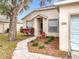 Close up of a home's inviting front entrance, walkway and well maintained landscaping at 250 Ryans Ridge Ave, Eustis, FL 32726