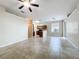 Living area featuring tile flooring, adjoining kitchen and natural light from a sliding door at 250 Ryans Ridge Ave, Eustis, FL 32726