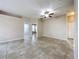 Spacious living room with neutral walls, tile flooring, and a modern ceiling fan at 250 Ryans Ridge Ave, Eustis, FL 32726