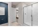 Modern bathroom with a glass-enclosed shower and doorway leading to the main bedroom at 2526 Winsome Way, Davenport, FL 33896