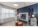 Stylish bedroom featuring starry wallpaper accent, grey carpet, and a white window at 2526 Winsome Way, Davenport, FL 33896