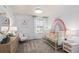 Bright Bedroom featuring white walls, plush carpet, and a whimsical rainbow wall decal at 2526 Winsome Way, Davenport, FL 33896