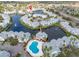 Overhead shot showcases waterfront community near lush landscaping, water features, and convenient parking at 2540 Woodgate Blvd # 106, Orlando, FL 32822