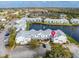 Panoramic aerial shot showing the community's prime location near the waterfront and lush surroundings at 2540 Woodgate Blvd # 106, Orlando, FL 32822