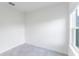 Well-lit bedroom with tile flooring, a window, and a minimalist aesthetic at 267 Marion Oaks Golf Rd, Ocala, FL 34473