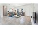 Inviting living room with neutral tones, tile flooring, and comfortable seating, creating a warm and welcoming atmosphere at 267 Marion Oaks Golf Rd, Ocala, FL 34473