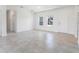 Open living room featuring bright windows, tile flooring, and a neutral-colored wall at 267 Marion Oaks Golf Rd, Ocala, FL 34473