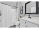 Bright bathroom with a shower/tub combo and black and white patterned floor at 281 Edisto Pl, Apopka, FL 32712