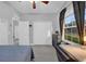 Cozy bedroom featuring natural light, gray walls, and wood-look flooring at 281 Edisto Pl, Apopka, FL 32712