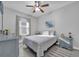 Bedroom with a large window and a ceiling fan provides a comfortable retreat at 281 Edisto Pl, Apopka, FL 32712