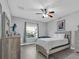 Bedroom with a large window providing plenty of natural light and a ceiling fan at 281 Edisto Pl, Apopka, FL 32712