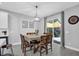 Dining area with table and chairs, chandelier, and sliding glass doors to the patio at 281 Edisto Pl, Apopka, FL 32712