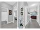 Hallway with gray wood flooring and white trim provides access to living areas at 281 Edisto Pl, Apopka, FL 32712