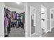 Well-organized walk-in closet providing ample storage space and easy access to clothing at 281 Edisto Pl, Apopka, FL 32712