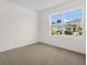 Bedroom featuring neutral carpeting and a window with a view of the neighborhood at 2921 Sunridge Loop, St Cloud, FL 34771