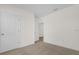 Bedroom showcasing neutral carpeting, closet, and ensuite bathroom access at 2921 Sunridge Loop, St Cloud, FL 34771