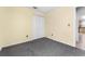 Neutral bedroom with carpet flooring, closet and doorway leading to additional rooms at 2980 Viscount Cir, Kissimmee, FL 34747