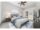 Cozy main bedroom featuring neutral tones, carpet, and ample natural light, creating a relaxing retreat at 2980 Viscount Cir, Kissimmee, FL 34747