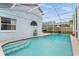 Enclosed pool with tile trim and poolside access to the home at 2980 Viscount Cir, Kissimmee, FL 34747