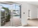 Sliding glass doors opening to a covered patio and the refreshing screened pool area at 2980 Viscount Cir, Kissimmee, FL 34747