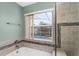 Shower with a window providing a view of the pool and backyard at 2980 Viscount Cir, Kissimmee, FL 34747