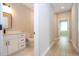 Bright bathroom featuring modern vanity, black fixtures, and wood-look tile in a hallway setting at 313 Mandrake St, Orlando, FL 32811