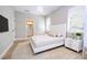 Neutral bedroom with white bed frame and view of ensuite bathroom at 313 Mandrake St, Orlando, FL 32811