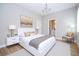 Bright bedroom with modern decor, including a white bed frame and views of ensuite bathroom at 313 Mandrake St, Orlando, FL 32811