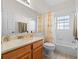 Well-lit bathroom with a single vanity, a combination shower and tub, and neutral finishes at 322 High Vista, Davenport, FL 33837