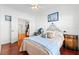 Well-lit bedroom with wood floors and view to living room at 322 High Vista, Davenport, FL 33837