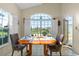 Bright dining area with white shutters and a scenic view of the outdoors at 322 High Vista, Davenport, FL 33837