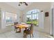 Cozy dining area with a view of the green outdoors, surrounded by bright windows at 322 High Vista, Davenport, FL 33837