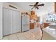 This kitchen features tile flooring, light wood cabinets, and white appliances at 322 High Vista, Davenport, FL 33837